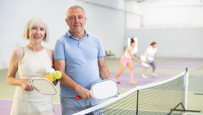 Two seniors on pickleball court